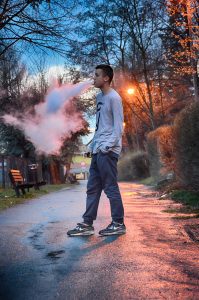 Young man vaping